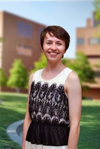 A three quarter portrait of Kristina on the Library green.