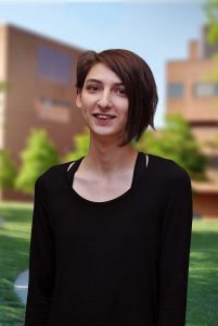 A three quarter portrait of Aline on the Library green.