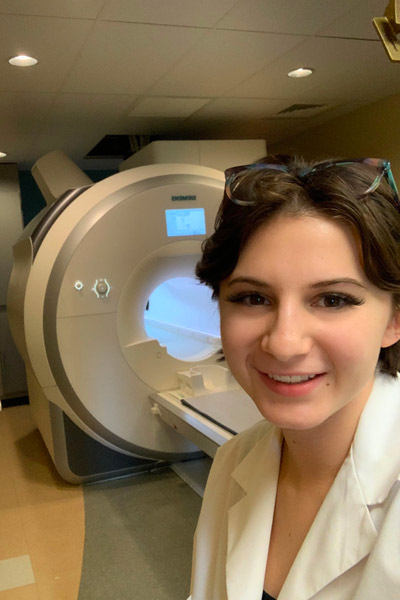 A young researcher standing in a lab